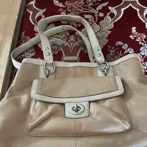 Tan colored Coach bag.